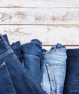 Jeans on wooden background